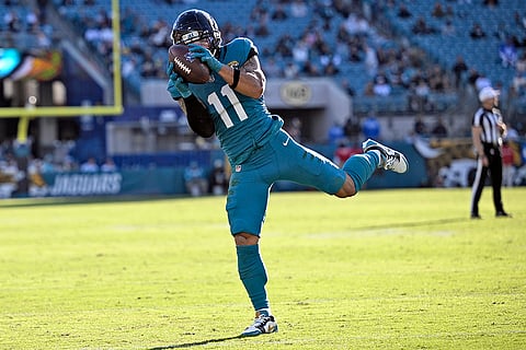 Texans vs Jaguars NFL Football: Jaguars wide receiver Parker Washington (11) pulls in a touchdown pass against the Texans