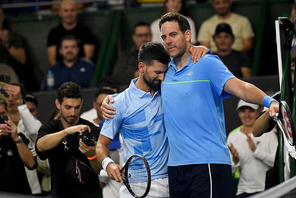 | Photo: AP/Gustavo Garello : Juan Martin Del Porto Retires: Novak Djokovic, left, embraces Argentina's Del Potro