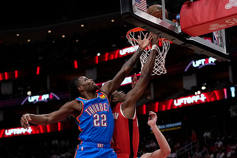NBA: Rockets forward Amen Thompson shoots against Thunder guard Cason Wallace