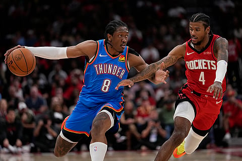 NBA: Rockets guard Jalen Green (4) defends against Thunder forward Jalen Williams