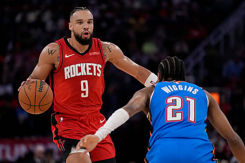 NBA: Thunder guard Aaron Wiggins (21) defends against Houston Rockets forward Dillon Brooks