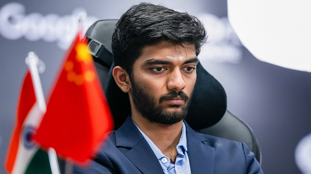 FIDE/Eng Chin An via PTI : D Gukesh reacts as he plays against Ding Liren during the eighth game of the World Chess Championship in Singapore on Wednesday (Dec. 4, 2024). 
