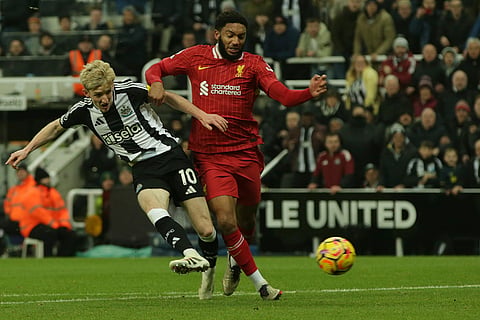 EPL 2024-25: Newcastle's Anthony Gordon, left, duels for the ball with Liverpool's Joe Gomez 
