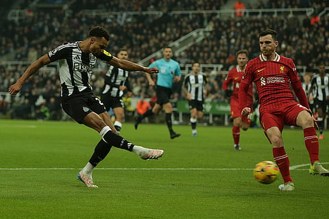 EPL 2024-25: Newcastle's Jacob Murphy, left, kicks the ball 