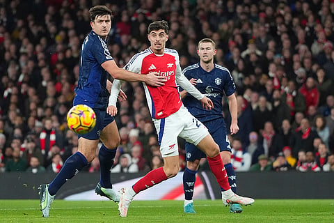 EPL 2024-25: Manchester United's Harry Maguire and Arsenal's Kai Havertz challenge for the ball 
