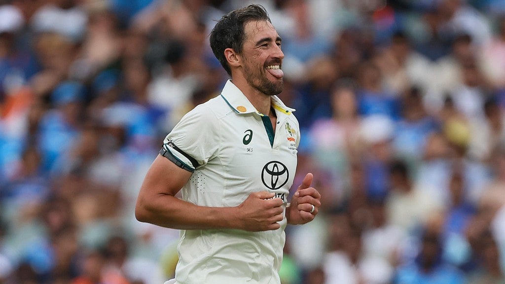 Mitchell Starc celebrates the wicket of Harshit Rana during day one of the second Test between Australia and India at the Adelaide Oval. - AP/James Elsby