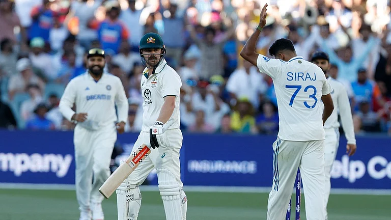 Mohammed Siraj (right) gives Travis Head a send-off after dismissing him during the second day of the second Test between India and Australia in Adelaide. - AP/James Elsby