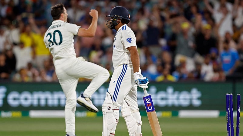 Pat Cummins celebrates the wicket of Rohit Sharma