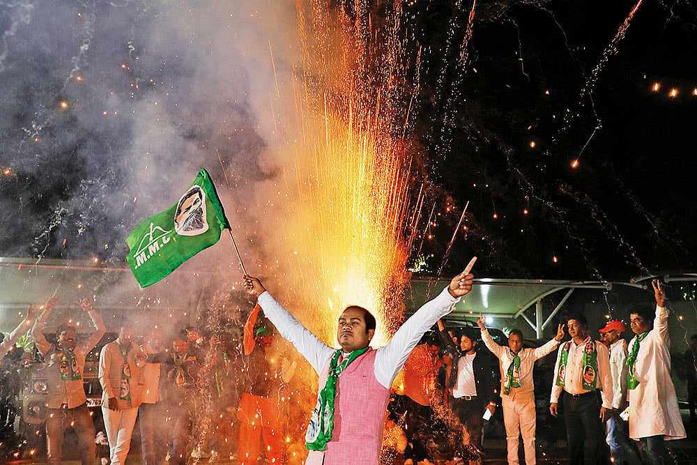 Photo: Anupam Parshant minz : Challenges Ahead: A supporter of the Jharkhand Mukti Morcha celebrating the victory