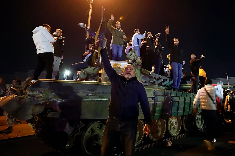Syrians celebrate the arrival of opposition fighters in Damascus, Syria - AP photo