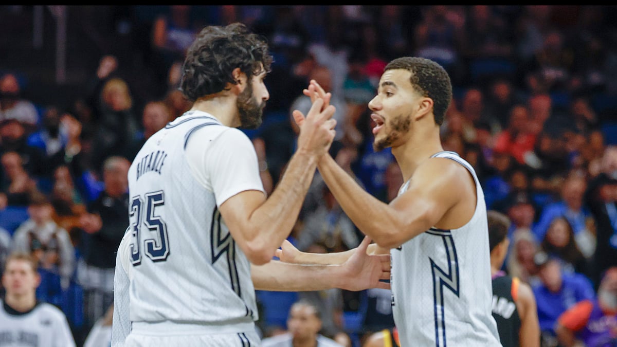 AP Photo/Kevin Kolczynski : Orlando Magic centre Goga Bitadze (35) and Orlando Magic guard Caleb Houston, right, talk after a play against the Phoenix Suns during the second half of an NBA basketball game.
