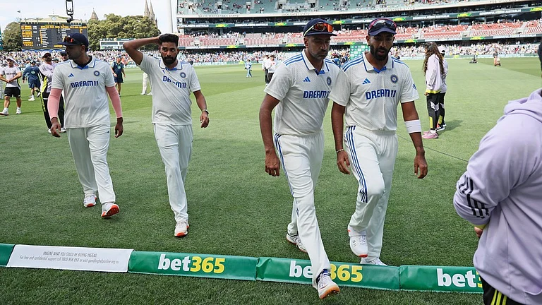 Indian players leave the field after their loss in the second Test against Australia at the Adelaide Oval. - AP/James Elsby