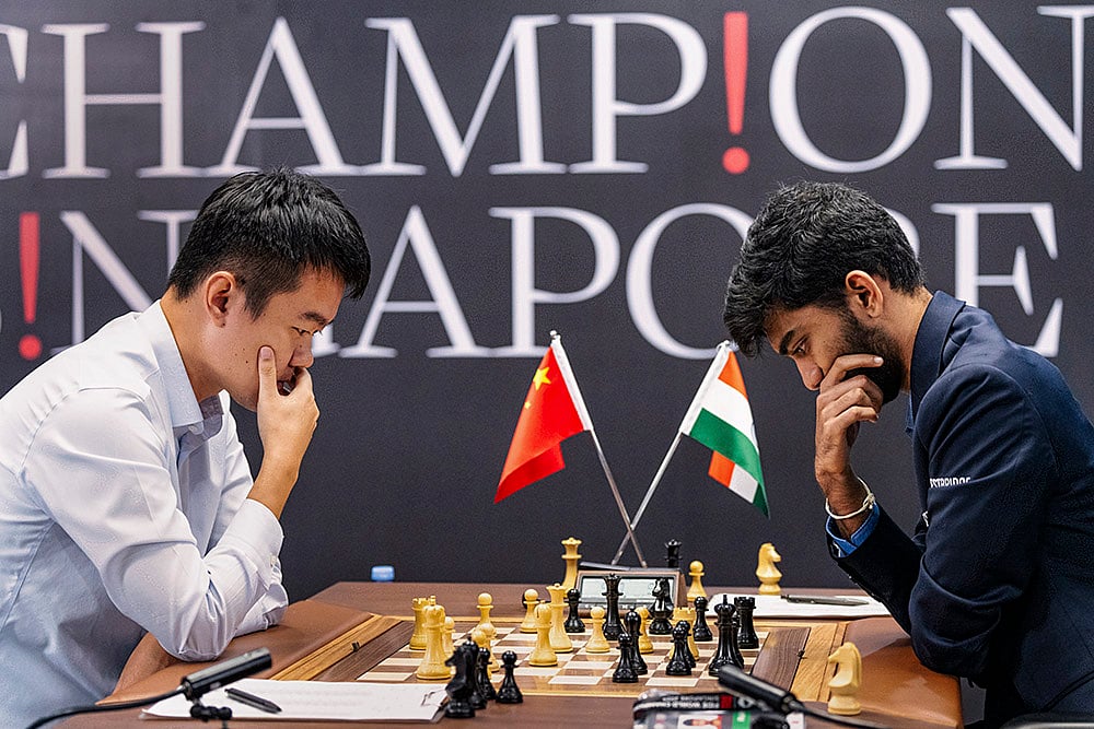 | Photo: FIDE/Eng Chin An via PTI : World Chess Championship: Gukesh D. and Ding Liren during the 12th game