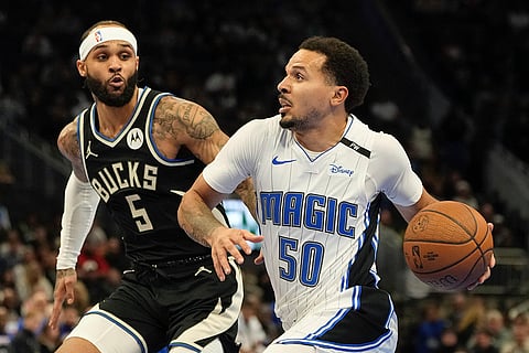 NBA Cup quarterfinals: Magic's Cole Anthony drives by Milwaukee Bucks' Gary Trent Jr.
