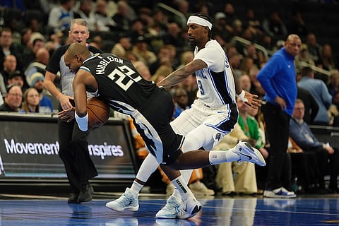 NBA Cup quarterfinals: Bucks' Khris Middleton and Magic's Kentavious Caldwell-Pope go after a loose ball
