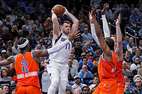 NBA Cup quarterfinals: Mavericks guard Luka Doncic, center, tries to pass the ball