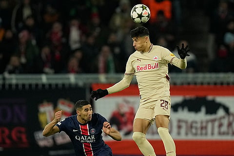 Champions League 2024-25: Salzburg's Adam Daghim heads a ball next to PSG's Achraf Hakimi 