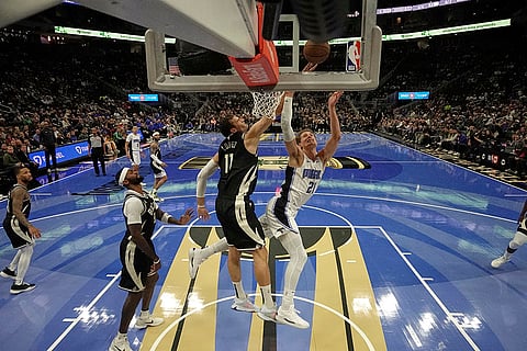 NBA Cup quarterfinals: Bucks' Brook Lopez blocks the shot of Magic's Moritz Wagner 
