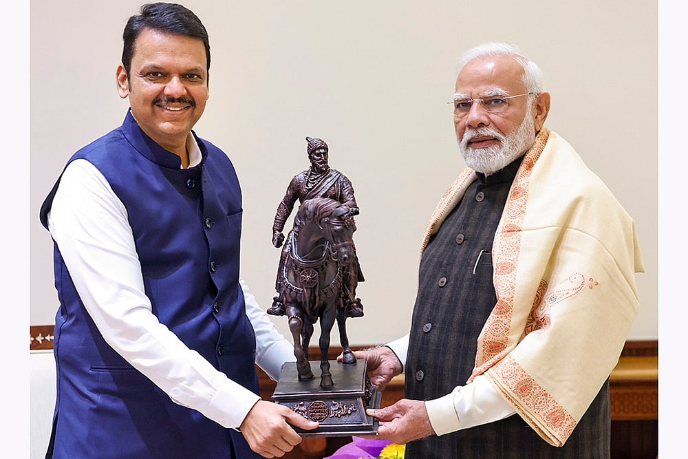 | Photo: PTI : PM Modi meets Devendra Fadnavis