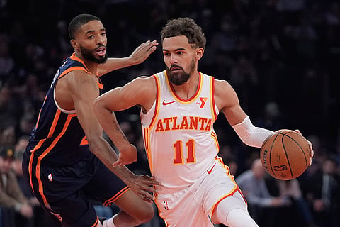 NBA Cup Quarter-Final: Hawks' Trae Young (11) drives past New York Knicks' Mikal Bridges 