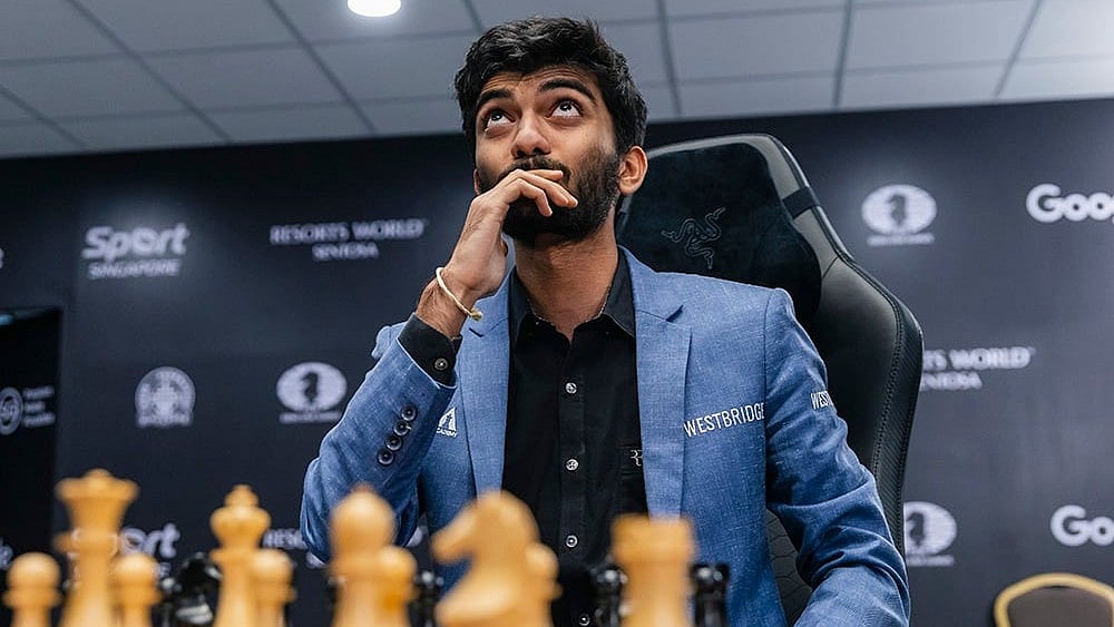 | Photo: FIDE/Eng Chin An via PTI  : India's D Gukesh responds to defeating China’s Ding Liren in the 2024 World Chess Championship 
