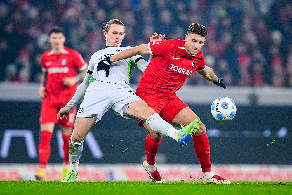 Germany Soccer Bundesliga 2024-25 SC Freiburg and VfL Wolfsburg football match pics: Patrick Wimmer