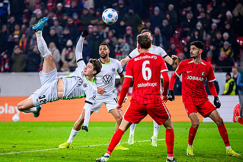Bundesliga 2024-25: Wolfsburg's Mattias Svanberg left, scores a goal