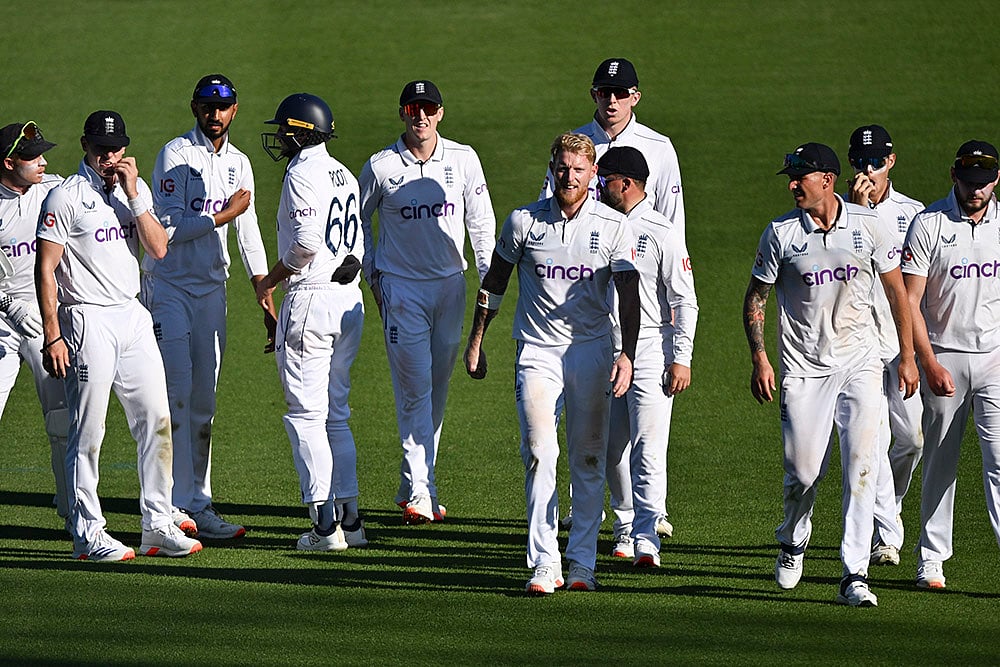 | Photo: Andrew Cornaga/Photosport via AP : NZ vs ENG 3rd Test Day 1: Ben Stokes, captain of England, leads his team off the field at the end of the day's play.