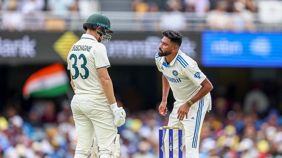 (AP Photo/Pat Hoelscher) : India's Mohammed Siraj, right, talks to Australia's Marnus Labuschagne during play on day two of the third cricket test between India and Australia at the Gabba in Brisbane, Australia, Sunday, Dec.15, 2024.