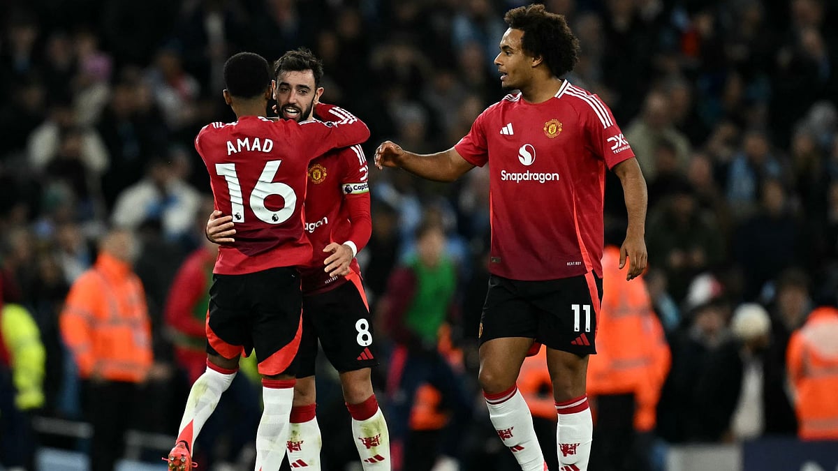 Fernandes (centre) hailed Amad (left) after his late winner - null