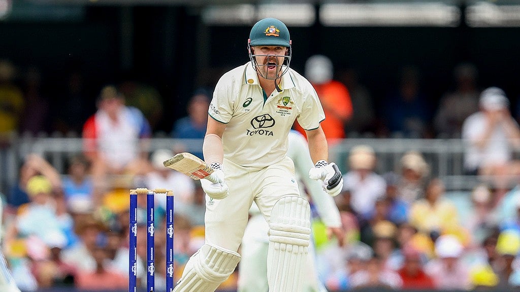 Australia's Travis Head reacts as he bats during play on day two of the third cricket test between India and Australia at the Gabba in Brisbane, Australia, Sunday, Dec.15, 2024. -  (AP Photo/Pat Hoelscher)