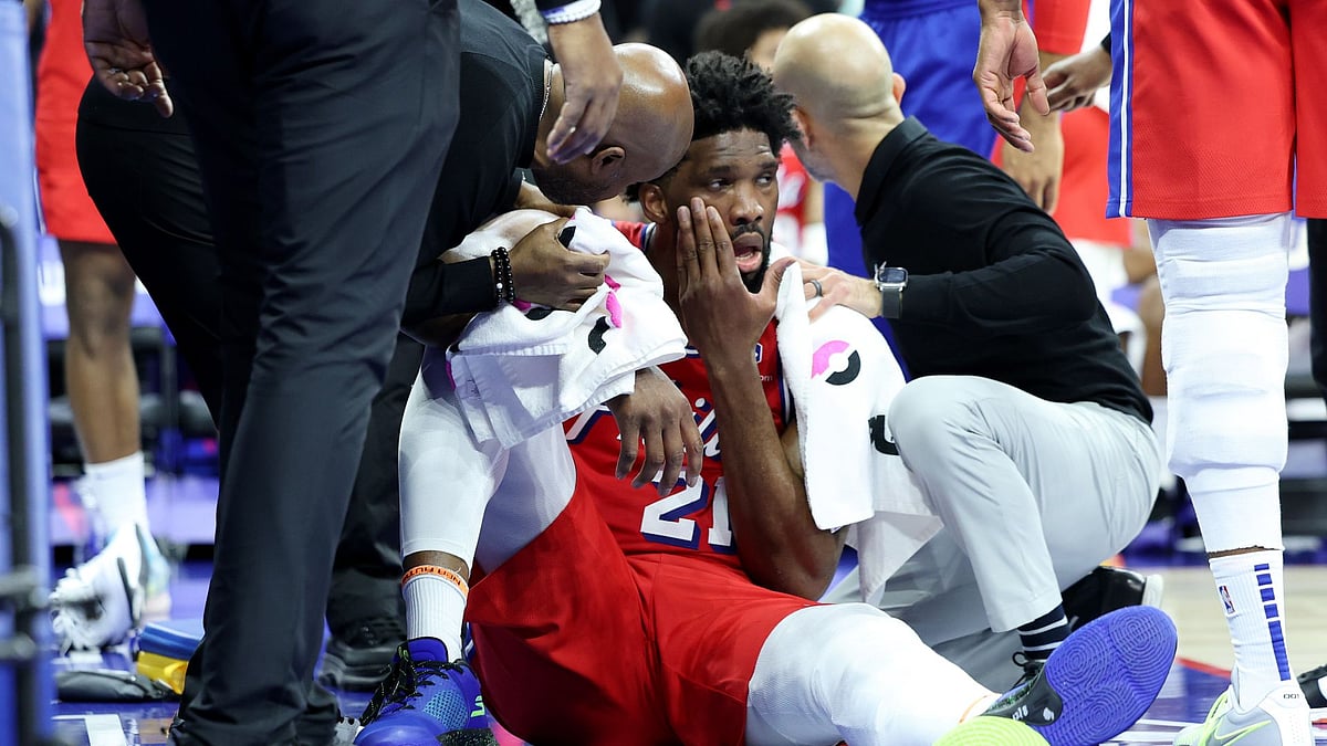 Embiid is tended to by the medical team