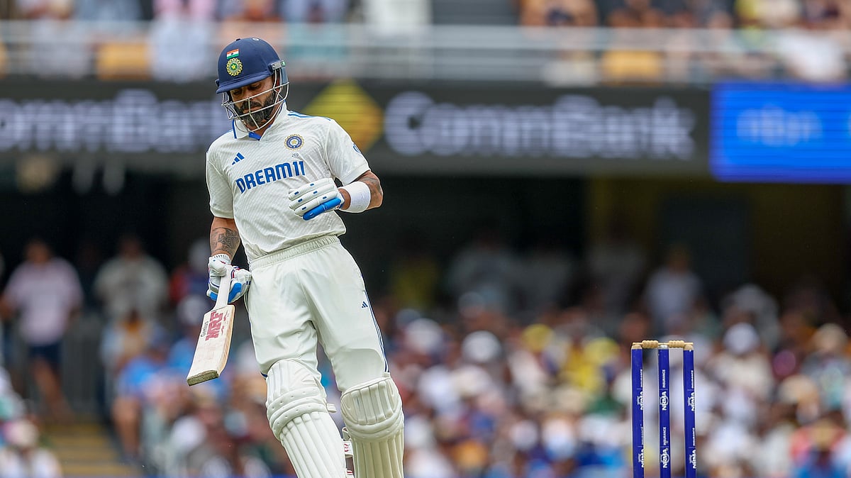 India's Virat Kohli run between the wickets to score during play on day three of the third cricket test between India and Australia at the Gabba in Brisbane. - AP Photo/Pat Hoelscher