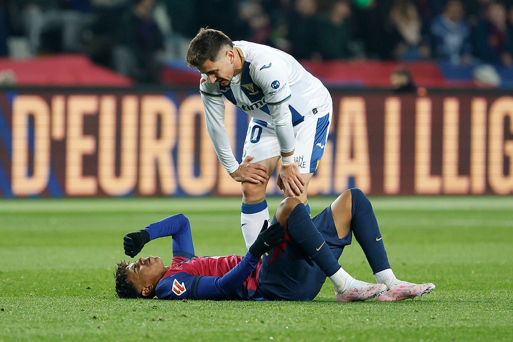 AP : Leganes' Javi Hernandez, top, talks to Barcelona's Lamine Yamal as he lies on the pitch after a challenge during the Spanish La Liga soccer match between Barcelona and Leganes at the Lluis Companys Olympic Stadium in Barcelona, Spain, Sunday, Dec. 15, 2024. 