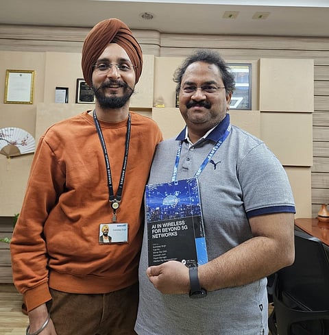 Left to right: Dr. Sukhdeep Singh (General Manager) and Mohan Rao GNS (Corporate Vice President & Managing Director, SRI-B) with a book SRI-B Engineers Contributed to – AI in Wireless for Beyond 5G Networks 