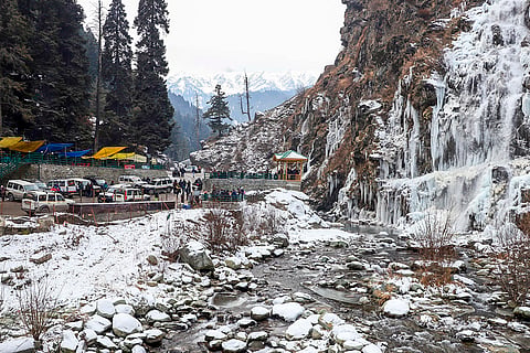 Cold wave in Kashmir valley: Tourists visit a frozen waterfall at Drung 