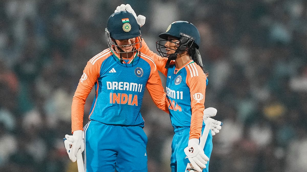 PTI/Kunal Patil : Smriti Mandhana (left) celebrates her half century with Jemimah Rodrigues 