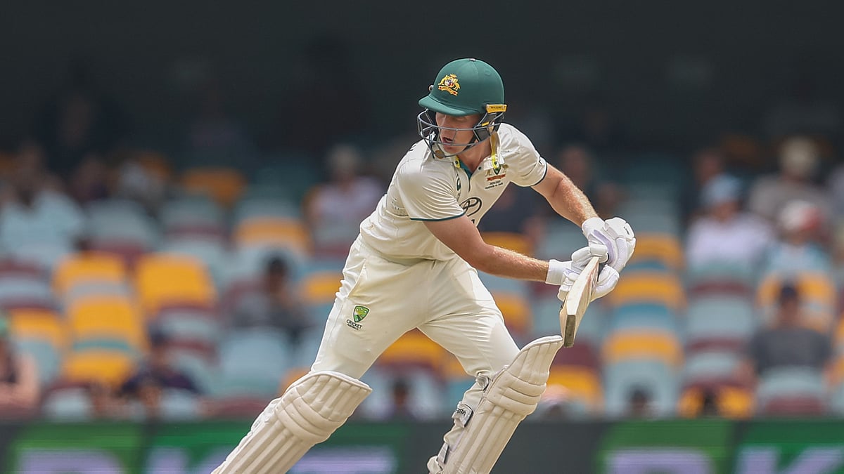 AP Photo/Pat Hoelscher : Australia's Nathan McSweeney bats during play on day five of the third cricket test between India and Australia at the Gabba in Brisbane, Australia.