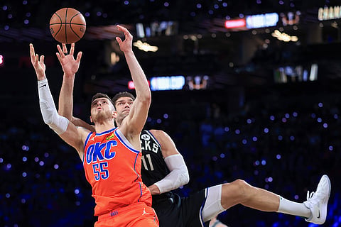 NBA Cup Final: Thunder center Isaiah Hartenstein (55) and Bucks center Brook Lopez (11) contest for a rebound