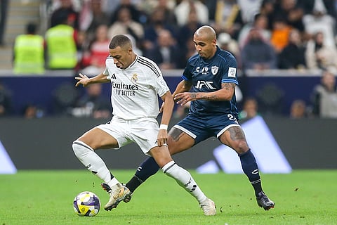Intercontinental Cup 2024: Real Madrid's Kylian Mbappe controls a ball chased by CF Pachuca's Luis Rodriguez 