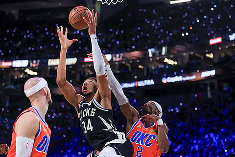 NBA Cup Final: Bucks forward Giannis Antetokounmpo (34) and Thunder guard Shai Gilgeous-Alexander (2) contest for a rebound