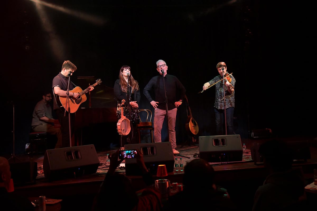 Irish Ambassador to India, Kevin Kelly, performing at the Irish Christmas event