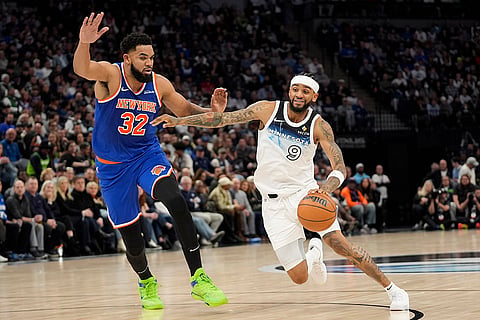 NBA: Timberwolves guard Nickeil Alexander-Walker (9) works toward the basket