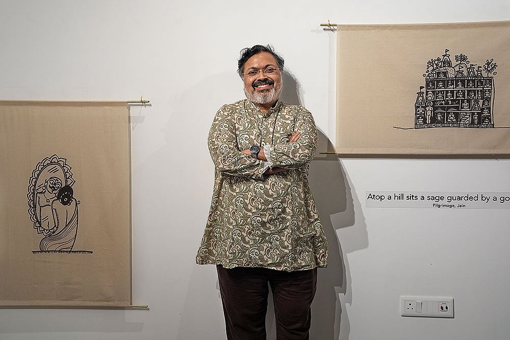 Glimpses: Devdutt Pattanaik with his exhibit at the Biennale