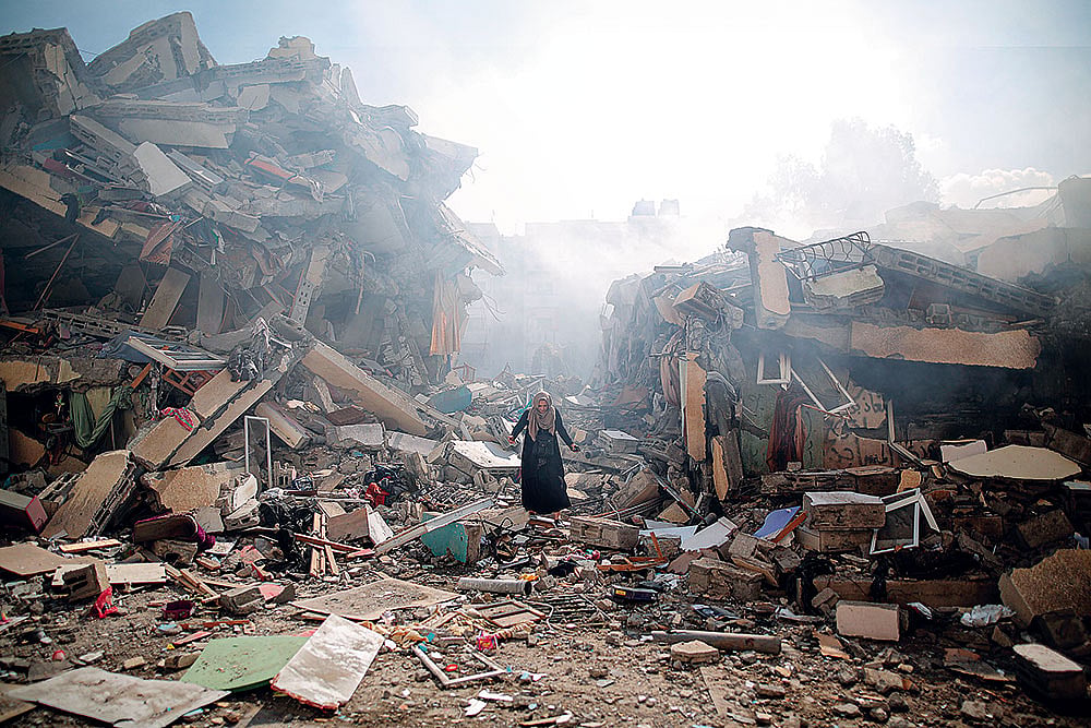 | Photo: Getty Images : All That Remains: A resident walks through the rubble of residential buildings after Israeli air-strikes in Gaza Strip on October 19, 2023