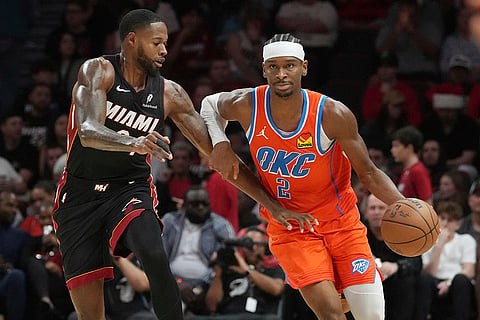 NBA 2024-25: Heat forward Haywood Highsmith (24) defends Thunder guard Shai Gilgeous-Alexander