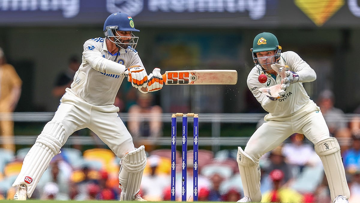 AP Photo/Pat Hoelscher : India's Ravindra Jadeja plays a shot during play on day four of the third cricket test between India and Australia at the Gabba in Brisbane.