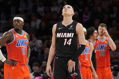 NBA 2024-25: Heat guard Tyler Herro (14) looks up to the scoreboard 