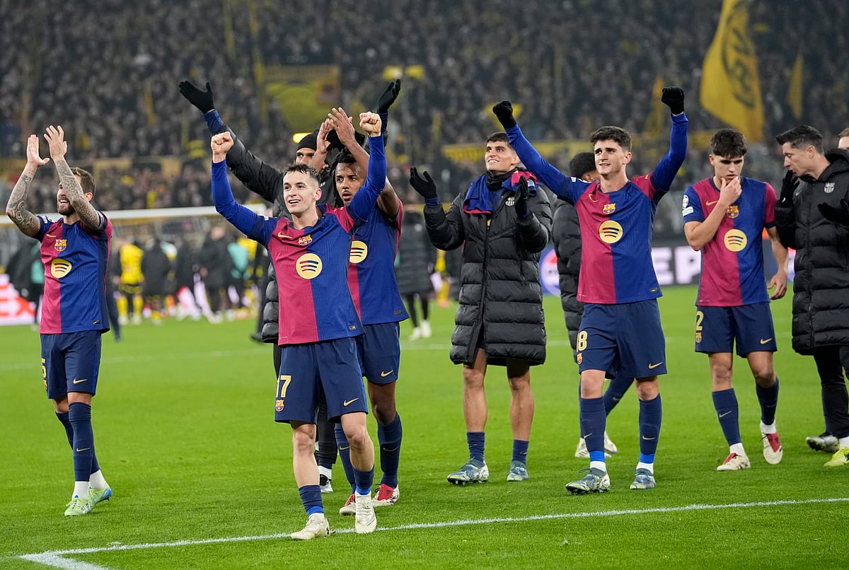 (AP Photo/Martin Meissner)
 : Barcelona players celebrate after beating Dortmund at the end of the Champions League opening phase soccer match between Borussia Dortmund and FC Barcelona at the Signal-Iduna Park in Dortmund, Germany, Wednesday Dec. 11, 2024. 

