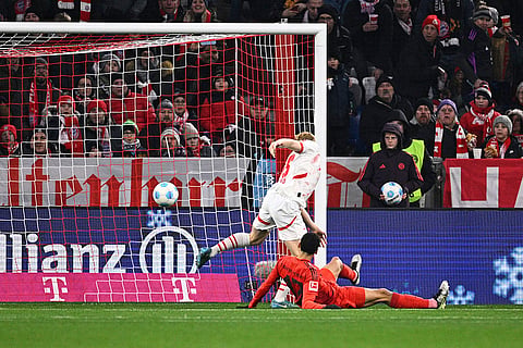 Bundesliga 2024-25: Munich's Jamal Musiala, on the ground, scores a goal